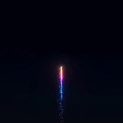 A rocket rises and bursts into color to reveal 2027 in the sky.