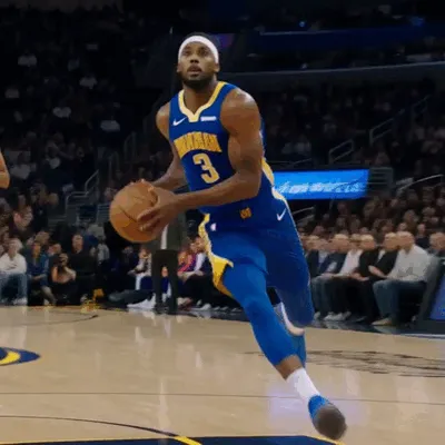 A basketball player leaps toward the hoop for a spectacular dunk.