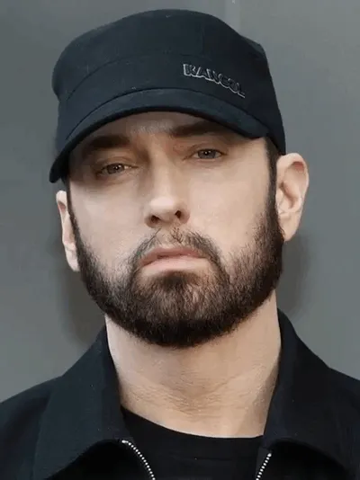 Eminem nods in a simple, direct show of approval.