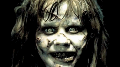 A close-up of an unsettling face with pale eyes, inspired by The Exorcist.