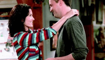 Monica and Chandler share a loving kiss.