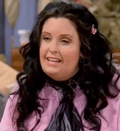 Monica cannot hold back her laughter.