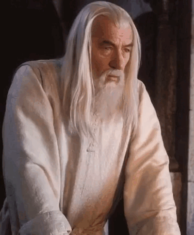 Gandalf looks sad and discouraged.
