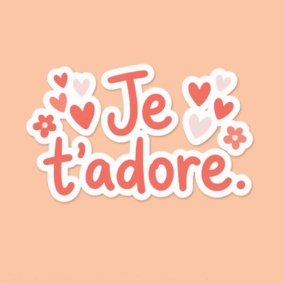 The French message "I adore you," surrounded by hearts and flowers on a peach background.