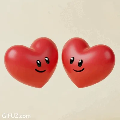 Deux petits cœurs rouges souriants se rapprochent sur un fond clair.