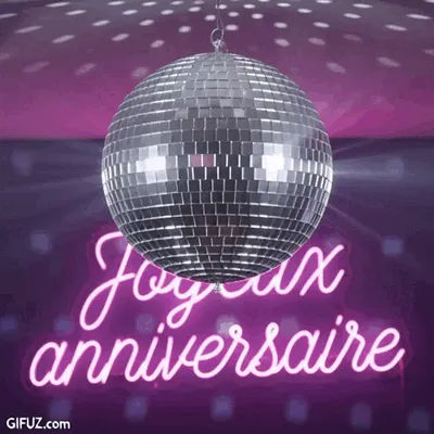 A disco ball spins in front of a pink neon Happy Birthday message.