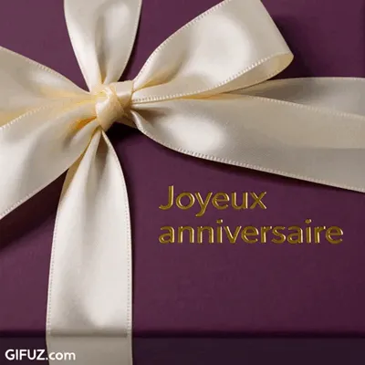 A purple gift with an ivory ribbon carries a Happy Birthday message in golden letters.