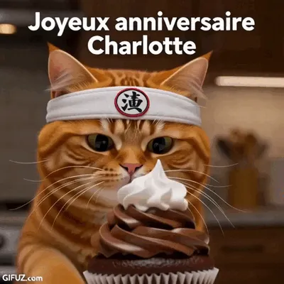 A ginger cat wearing a headband leans over a cupcake for Charlotte's birthday.