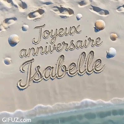 Happy Birthday Isabelle is written in the sand beside the water, surrounded by seashells.