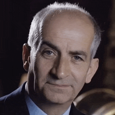 Louis de Funès approves with a knowing expression.