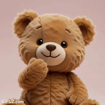 A teddy bear raises a paw to its mouth to blow a kiss.