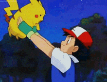 Ash lifts Pikachu in a happy, affectionate moment.