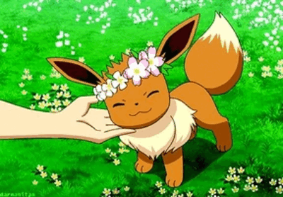 Eevee enjoys a caress while wearing a flower crown.