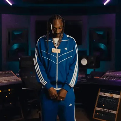 Snoop Dogg dances in a recording studio.