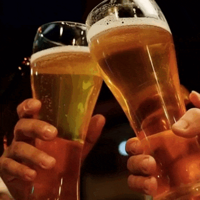 Two beer glasses meet for a toast.